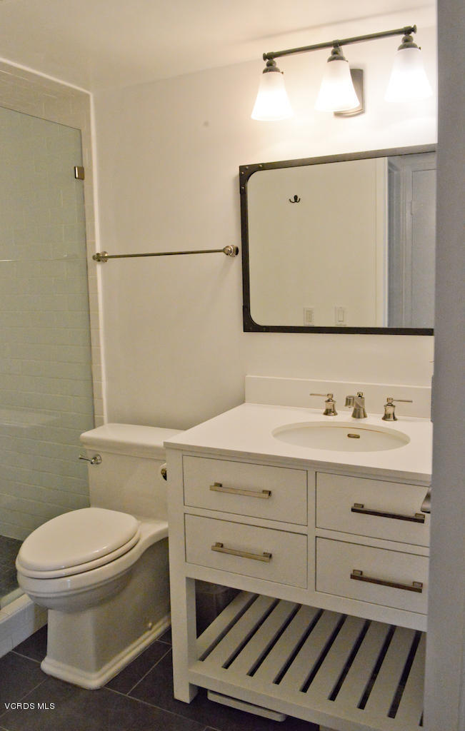 3624 Sunset Lane Oxnard, CA 93035 - Photo 17 of 26 a bathroom with a toilet sink and mirror