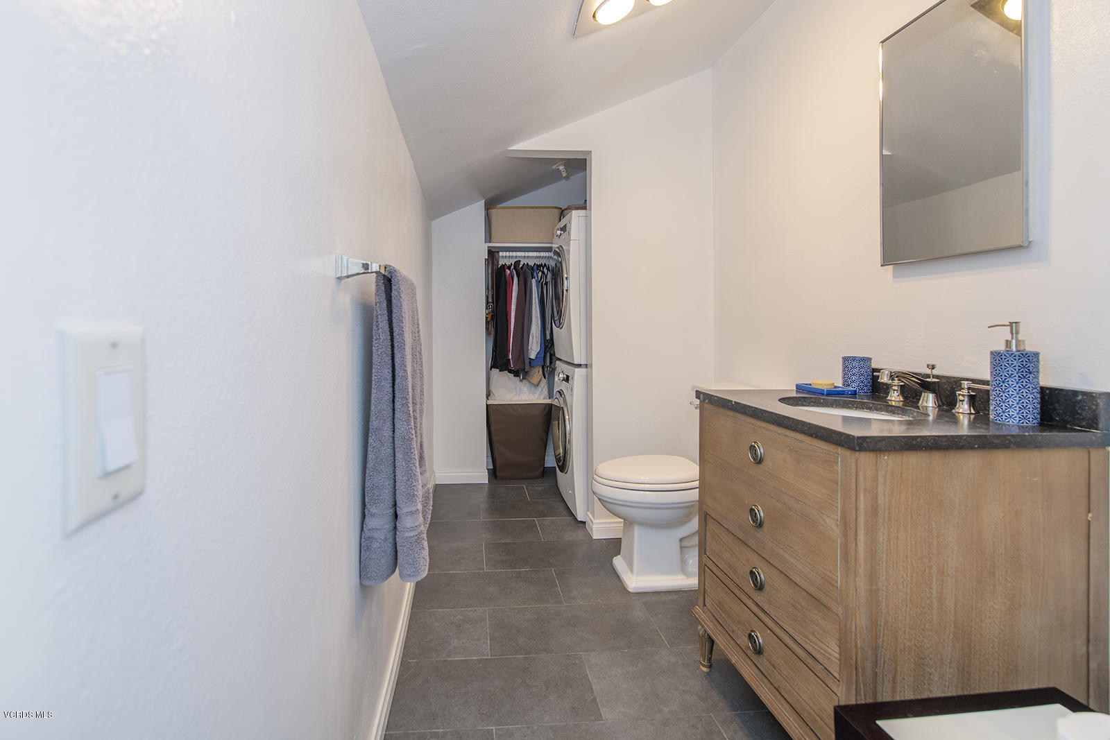 3624 Sunset Lane Oxnard, CA 93035 - Photo 23 of 26 a bathroom with a toilet sink and mirror