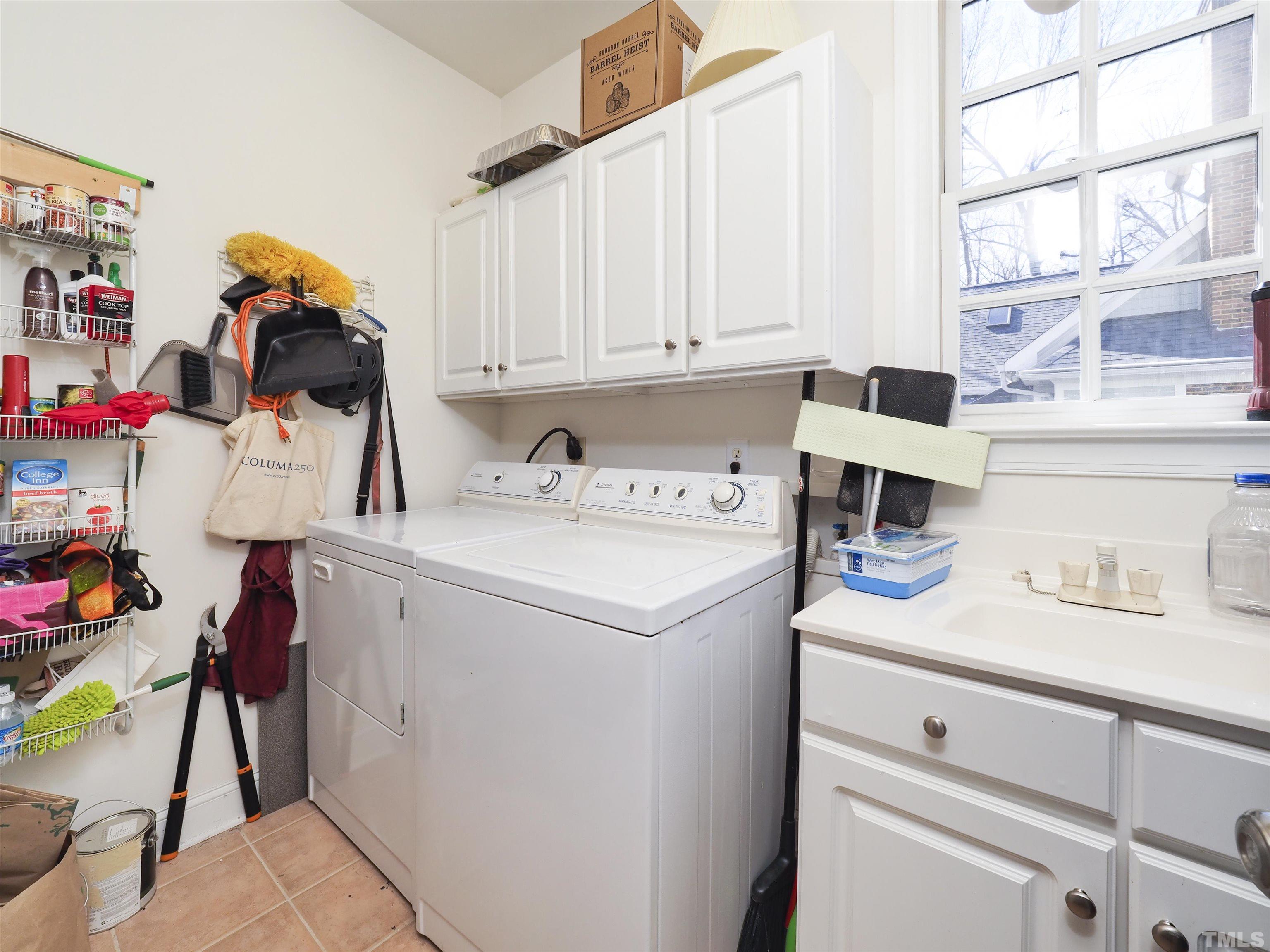 42 Cheswick Place Durham, NC 27707 - Photo 16 of 27 a utility room with dryer and washer