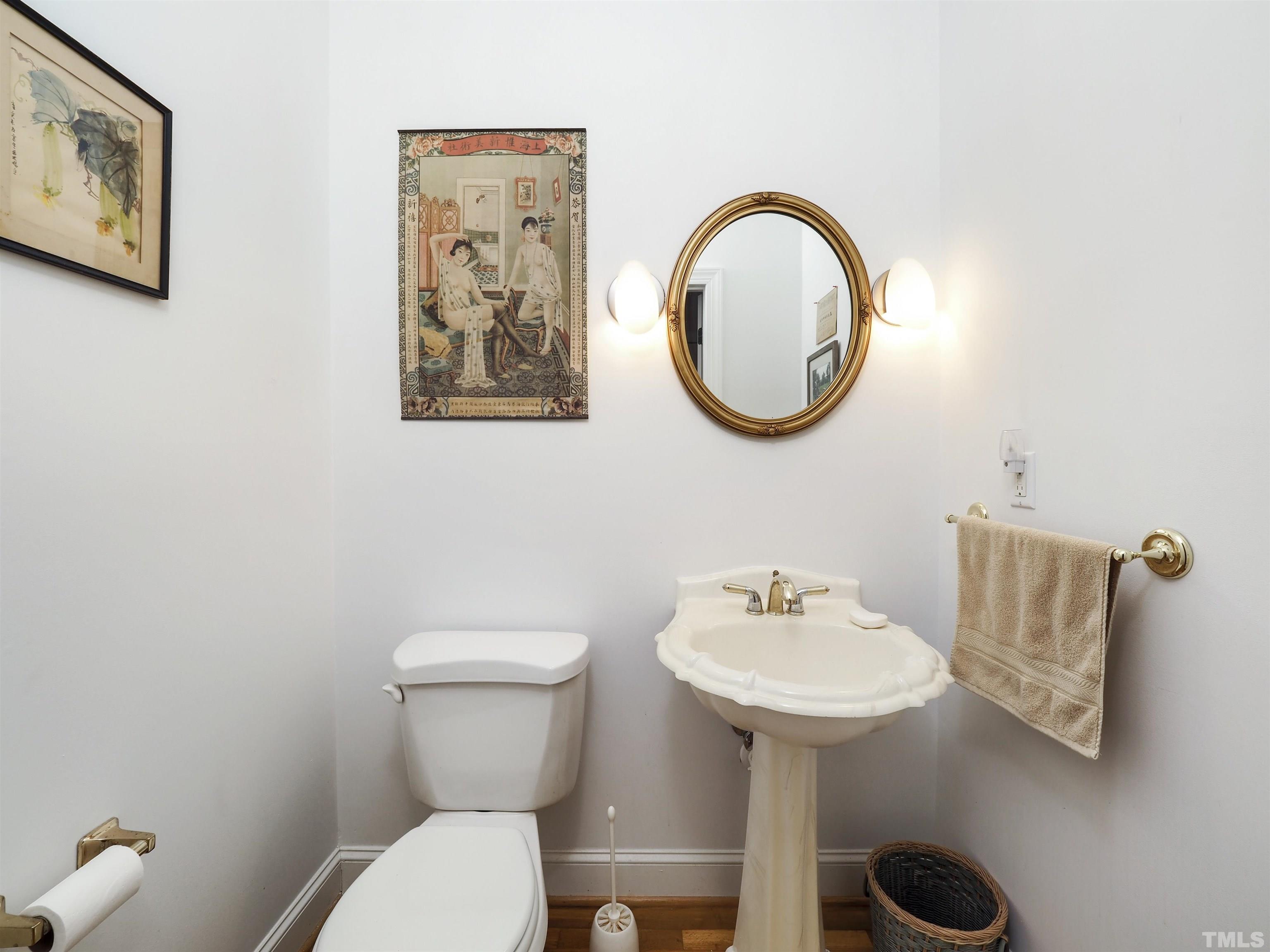 42 Cheswick Place Durham, NC 27707 - Photo 18 of 27 a bathroom with a toilet a sink and a mirror