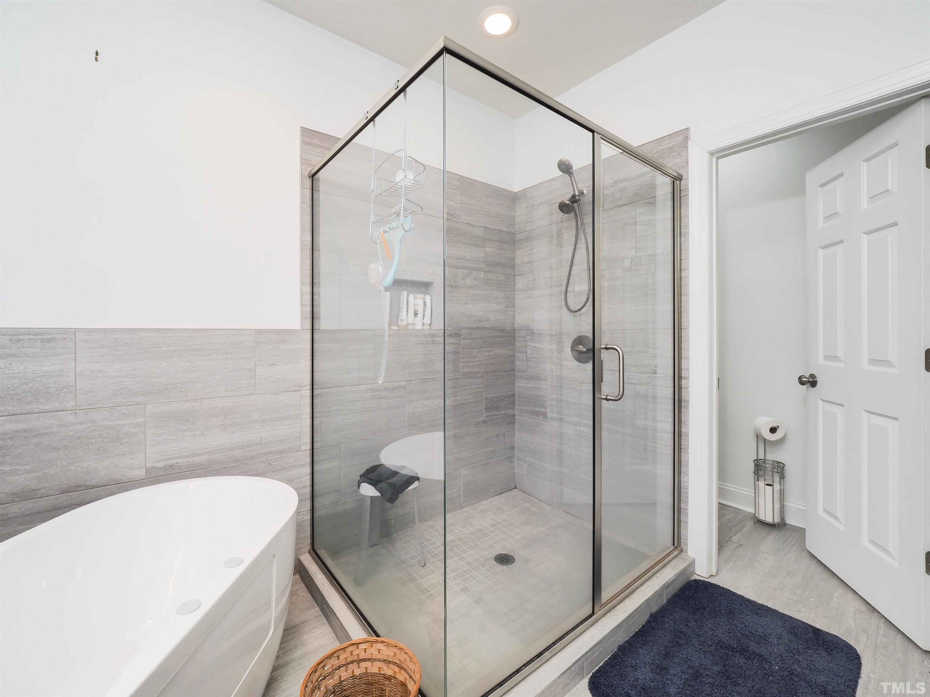 42 Cheswick Place Durham, NC 27707 - Photo 21 of 27 a bathroom with a bathtub and a shower