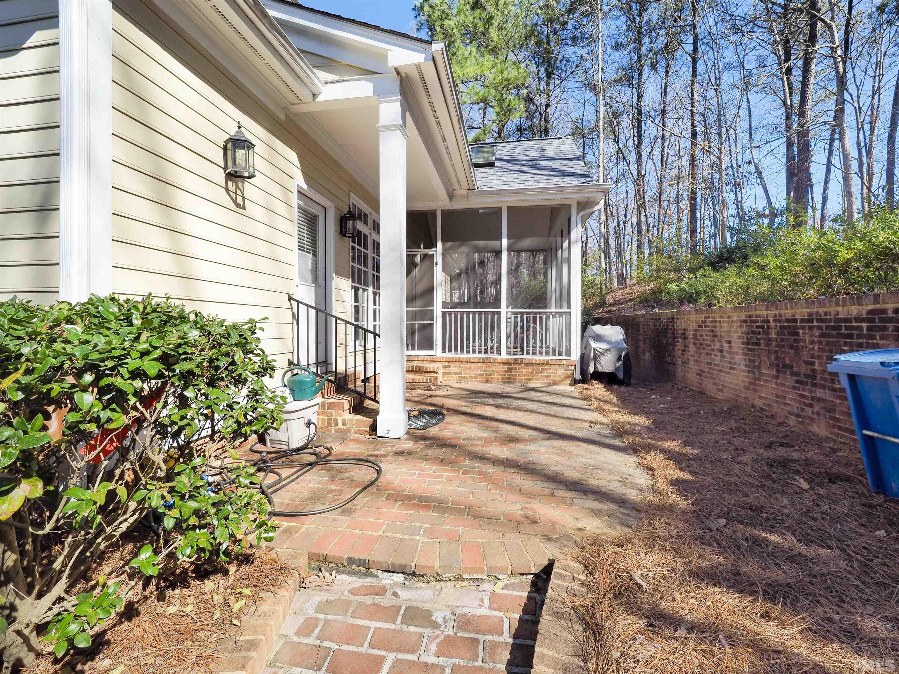 42 Cheswick Place Durham, NC 27707 - Photo 27 of 27 a view of a house with backyard and sitting area