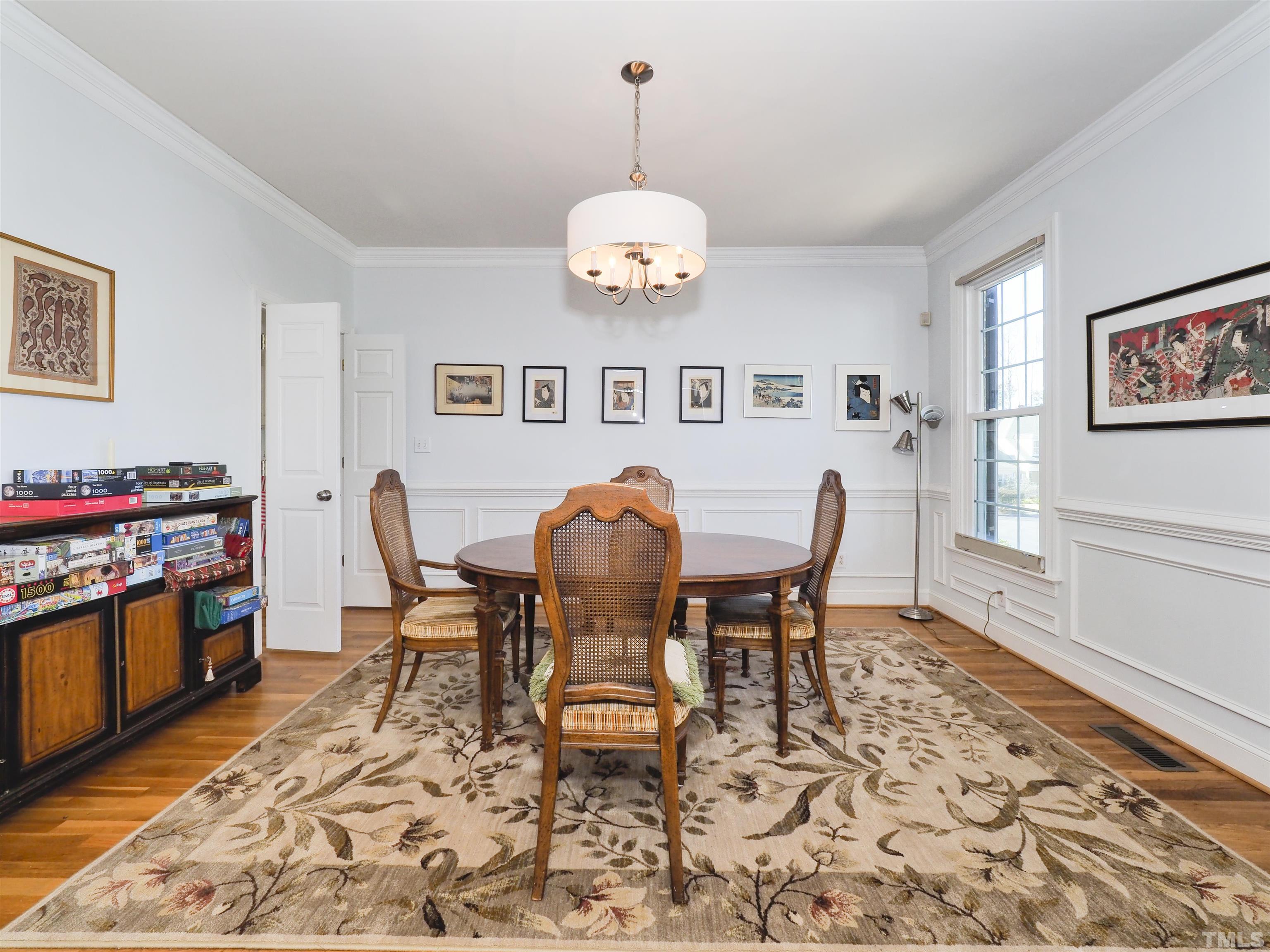 42 Cheswick Place Durham, NC 27707 - Photo 6 of 27 a view of a dining room with furniture and wooden floor