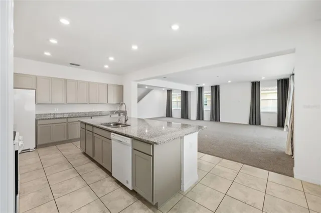 a view of an empty room and a window