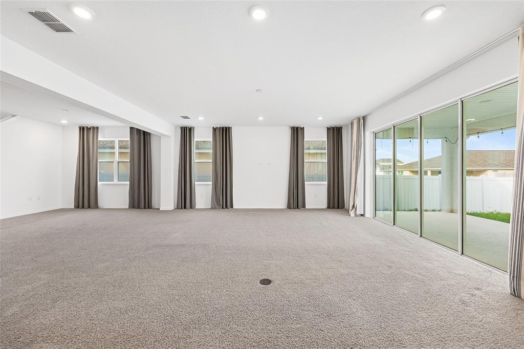 7635 Southwest 64th St Road Ocala, FL 34474 - Photo 22 of 86 a view of an empty room with glass door