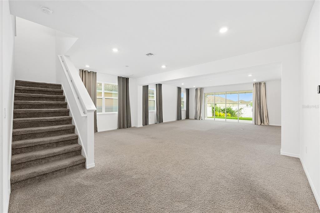 7635 Southwest 64th St Road Ocala, FL 34474 - Photo 24 of 86 a view of an empty room with stairs and a window