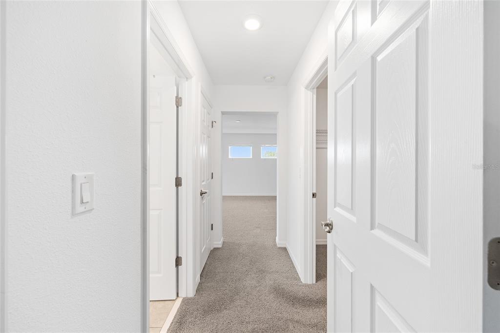 7635 Southwest 64th St Road Ocala, FL 34474 - Photo 27 of 86 a view of a hallway with wooden shelves