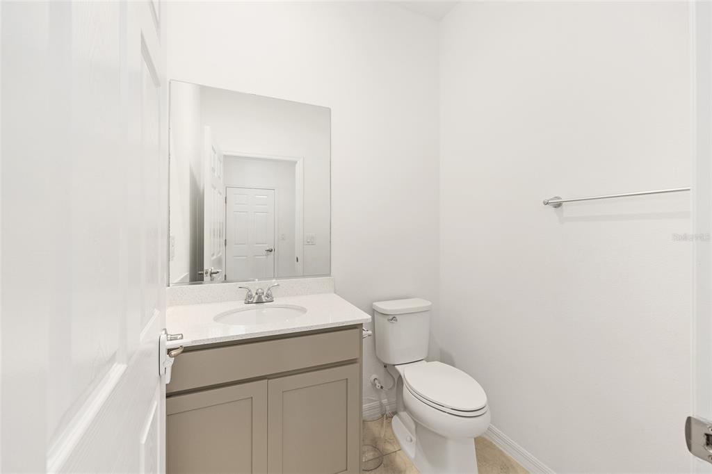 7635 Southwest 64th St Road Ocala, FL 34474 - Photo 32 of 86 a bathroom with a toilet sink and mirror