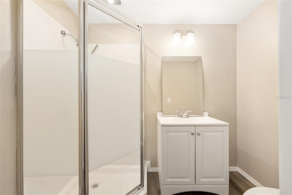 7635 Southwest 64th St Road Ocala, FL 34474 - Photo 37 of 86 a bathroom with a sink and a mirror