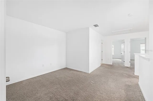 an aerial view of a house yard swimming pool and ocean view