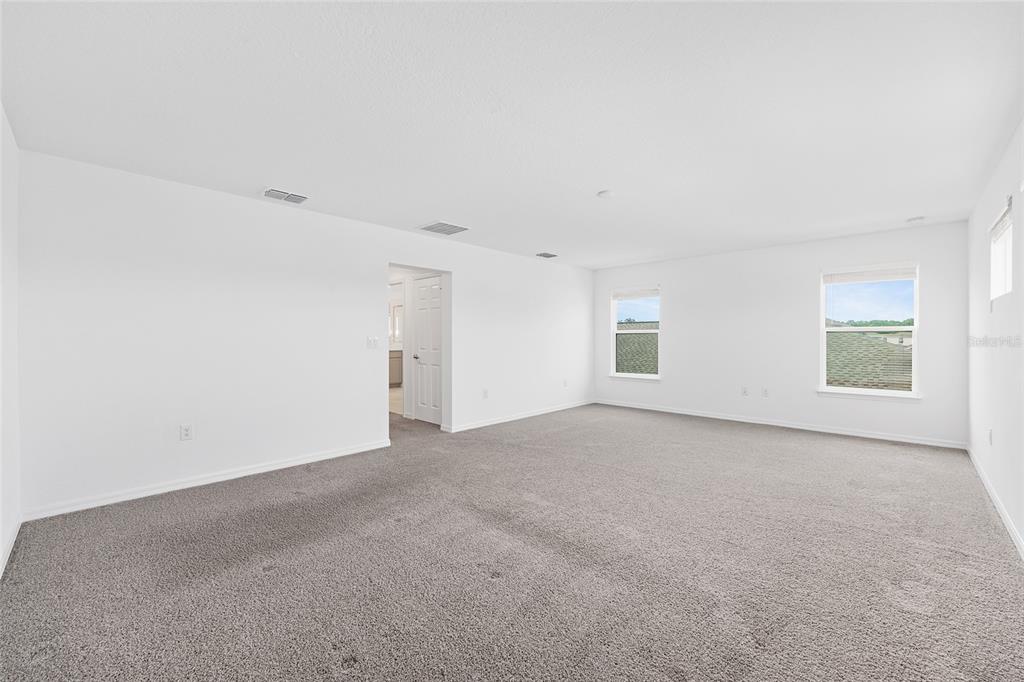 7635 Southwest 64th St Road Ocala, FL 34474 - Photo 48 of 86 an empty room with windows and closet