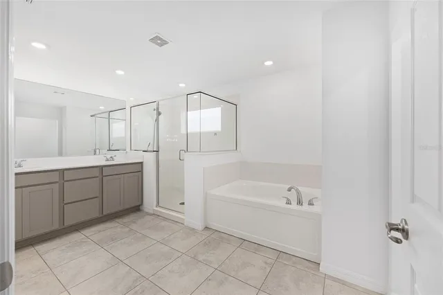 a view of residential houses with outdoor space and river view