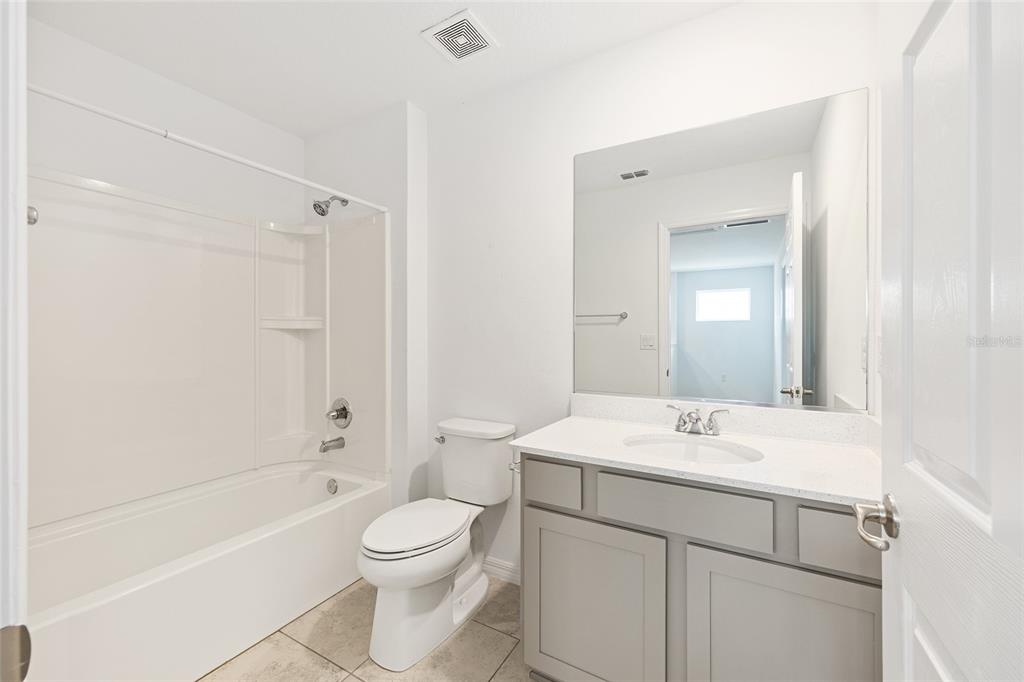 7635 Southwest 64th St Road Ocala, FL 34474 - Photo 55 of 86 a bathroom with a sink a toilet and shower