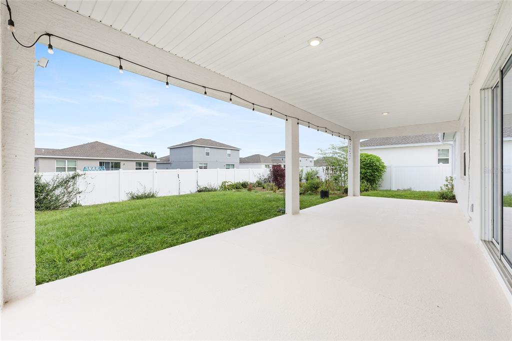 7635 Southwest 64th St Road Ocala, FL 34474 - Photo 59 of 86 a view of a house with a yard and table and chair