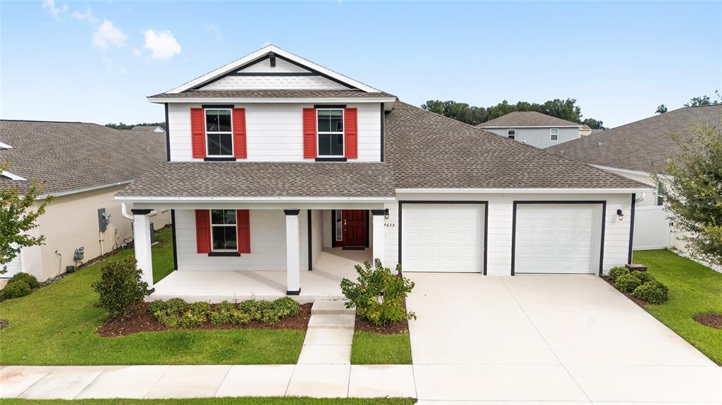 7635 Southwest 64th St Road Ocala, FL 34474 - Photo 65 of 86 a front view of a house with garden