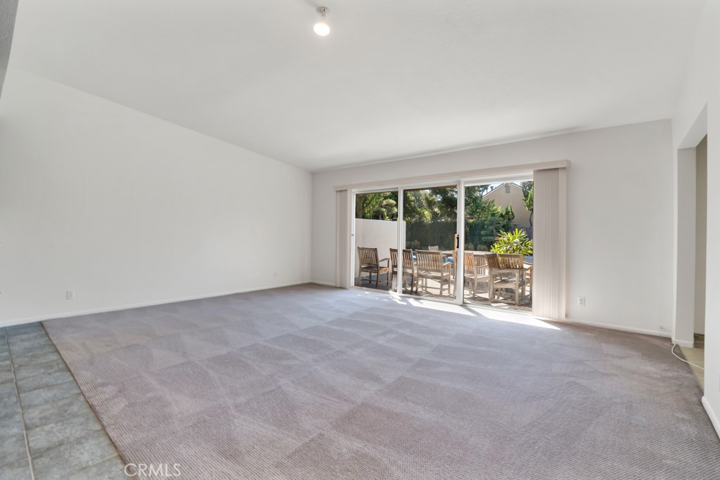 18912 Blackhawk Street Porter Ranch, CA 91326 - Photo 13 of 48 a view of an empty room with glass door and balcony