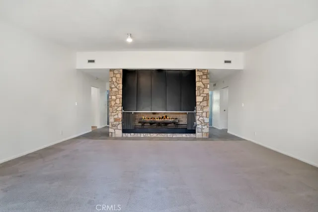 a view of a livingroom with a fireplace