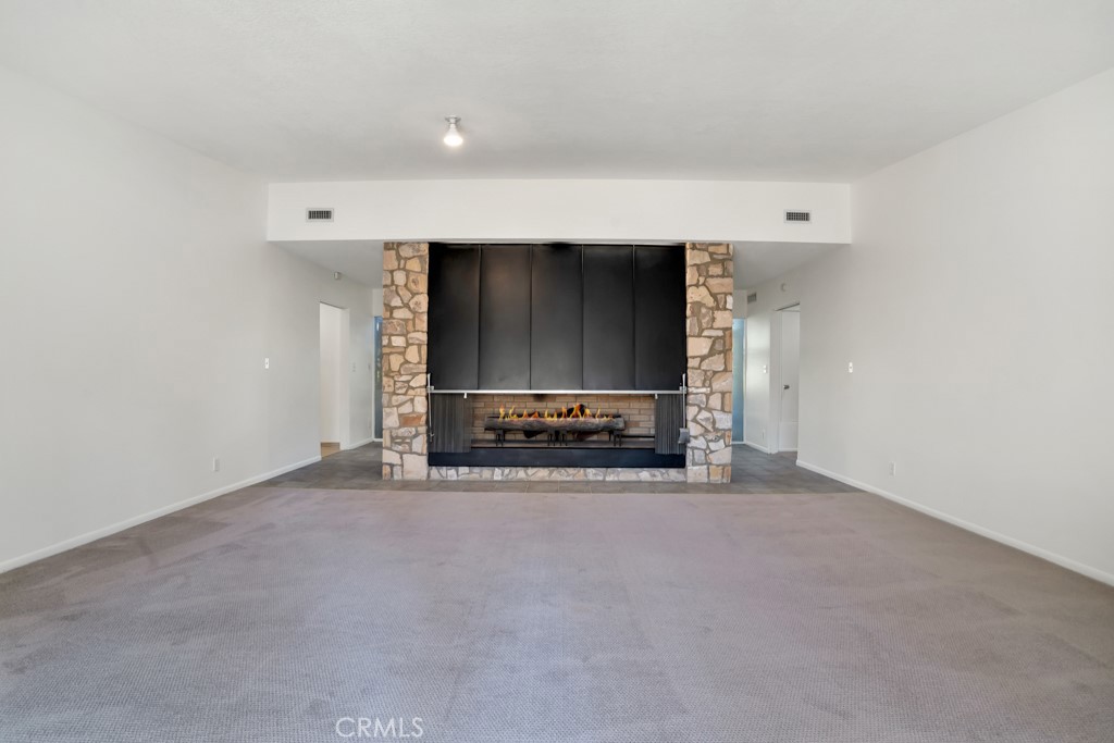 18912 Blackhawk Street Porter Ranch, CA 91326 - Photo 15 of 48 a view of a livingroom with a fireplace