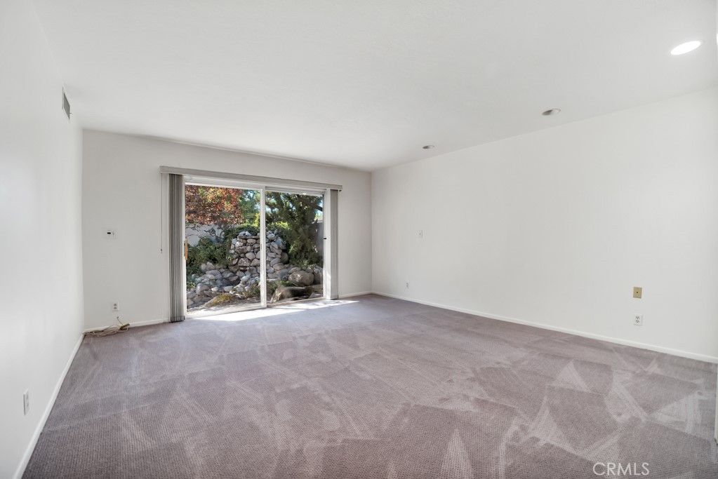 18912 Blackhawk Street Porter Ranch, CA 91326 - Photo 19 of 48 an empty room with large windows