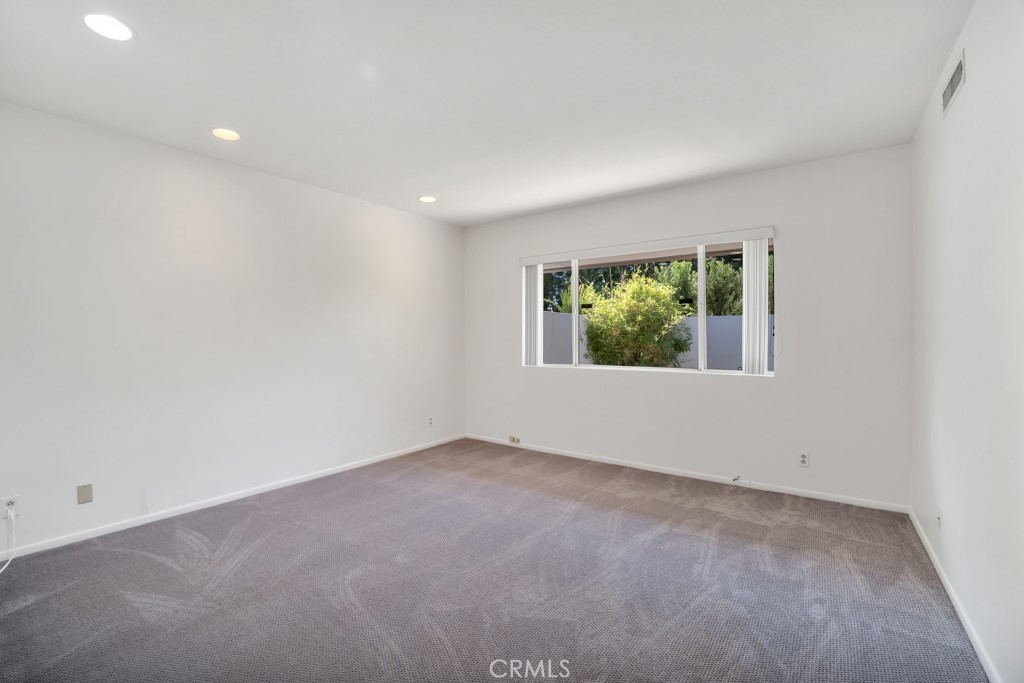 18912 Blackhawk Street Porter Ranch, CA 91326 - Photo 29 of 48 an empty room with windows