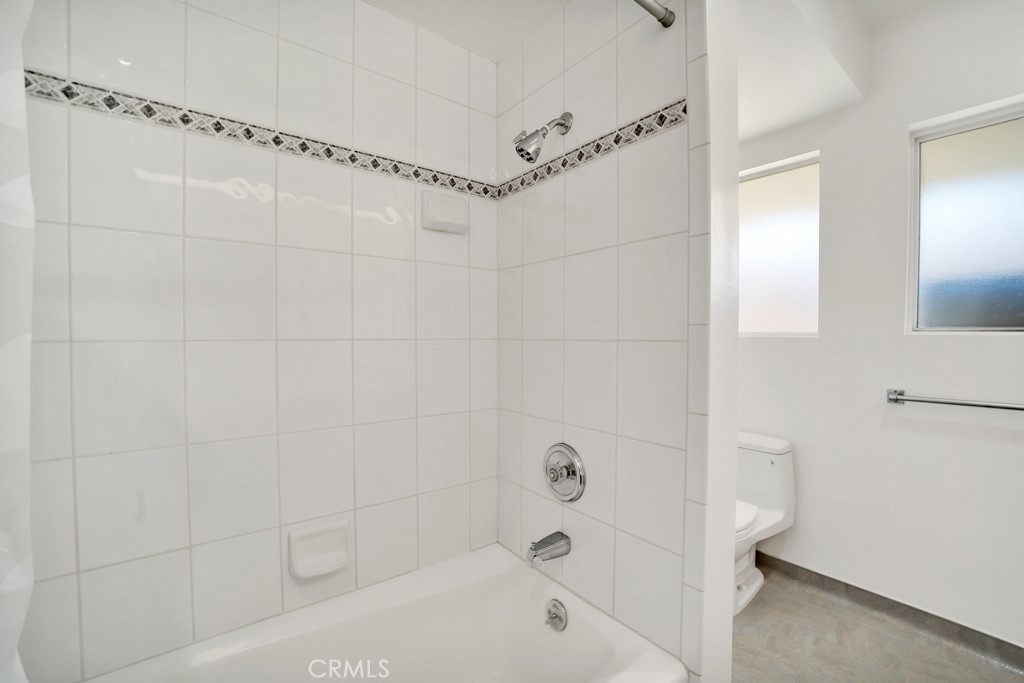 18912 Blackhawk Street Porter Ranch, CA 91326 - Photo 30 of 48 a bathroom with a bathtub and a shower