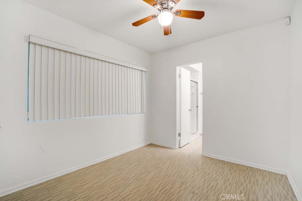 18912 Blackhawk Street Porter Ranch, CA 91326 - Photo 35 of 48 an empty room with a window and a ceiling fan