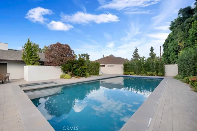 a view of a swimming pool with chairs