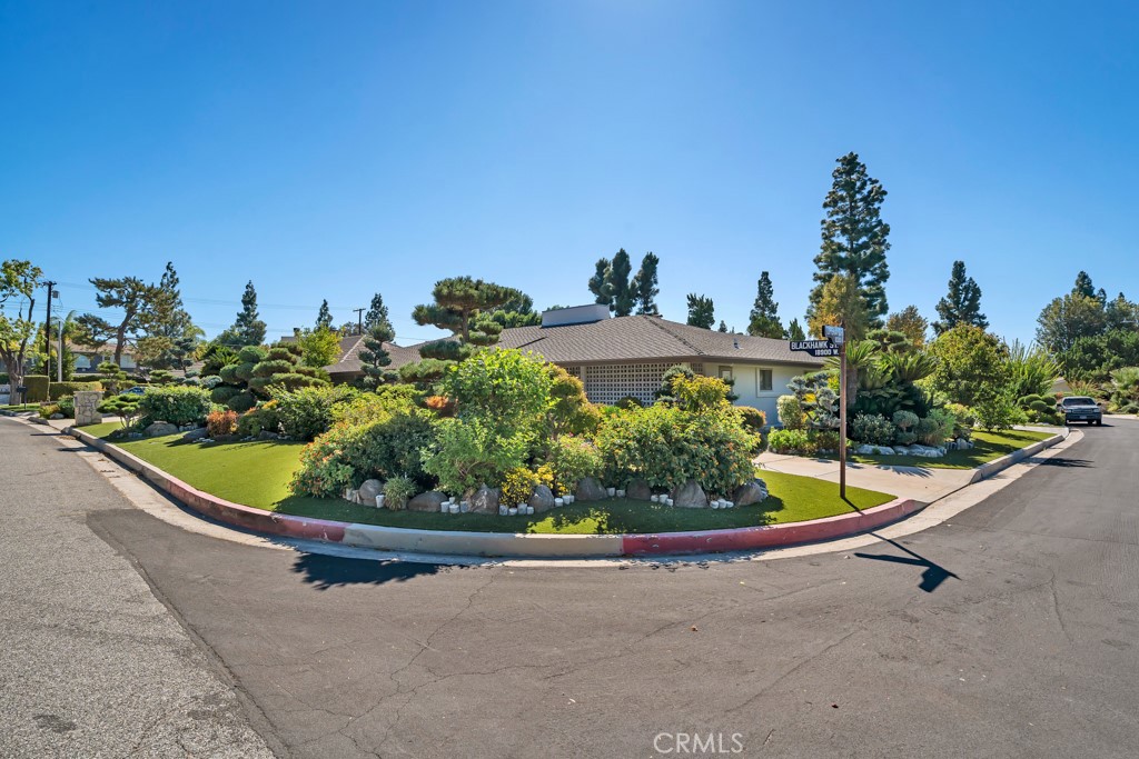 18912 Blackhawk Street Porter Ranch, CA 91326 - Photo 4 of 48 a picture of a yard in front of a house