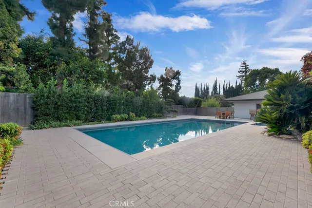 a view of a patio with a table and chairs