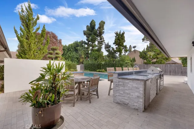 a balcony with furniture and a potted plant