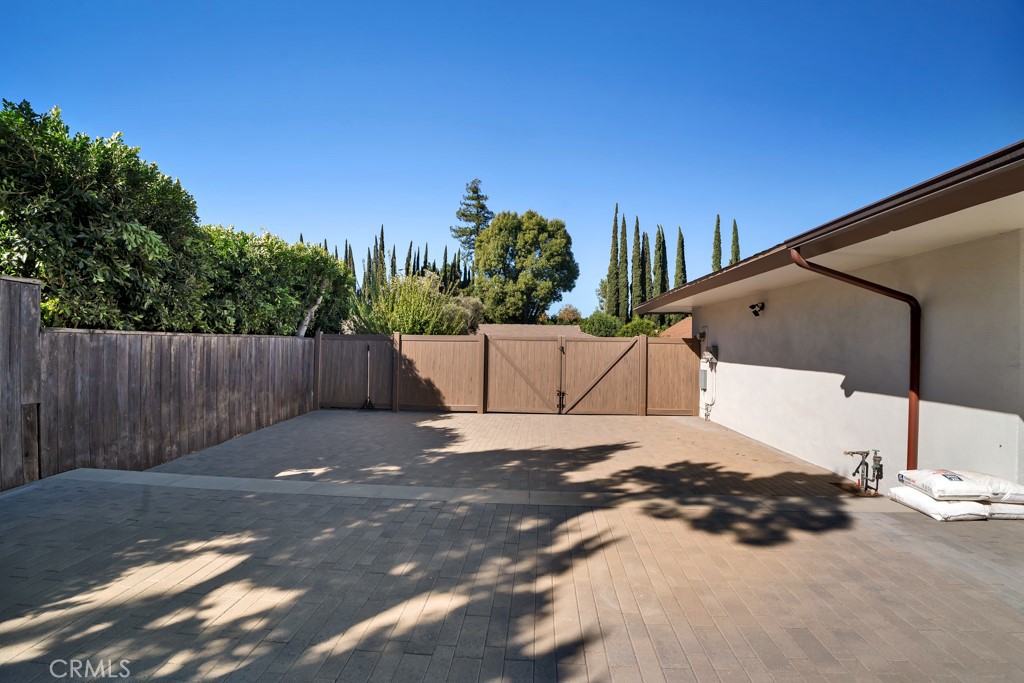 18912 Blackhawk Street Porter Ranch, CA 91326 - Photo 45 of 48 a backyard of a house with an outdoor space and seating area