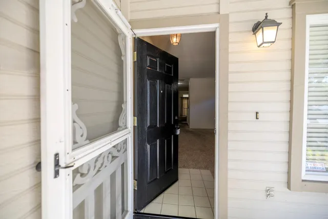 a view of hallway with livingroom