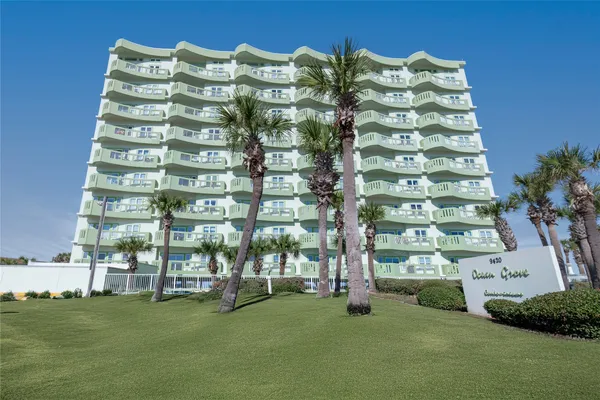 a tall building with a yard