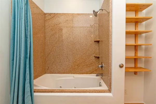 a bathroom with a bath tub