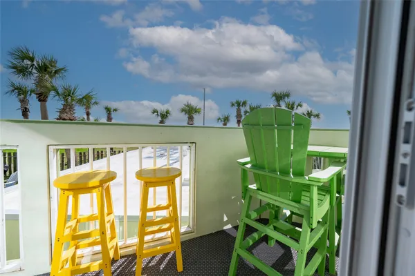 a view of a swimming pool with an outdoor seating