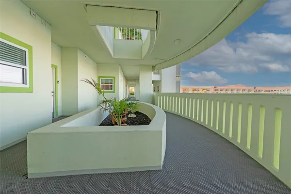 a view of swimming pool with a bench and lawn chairs