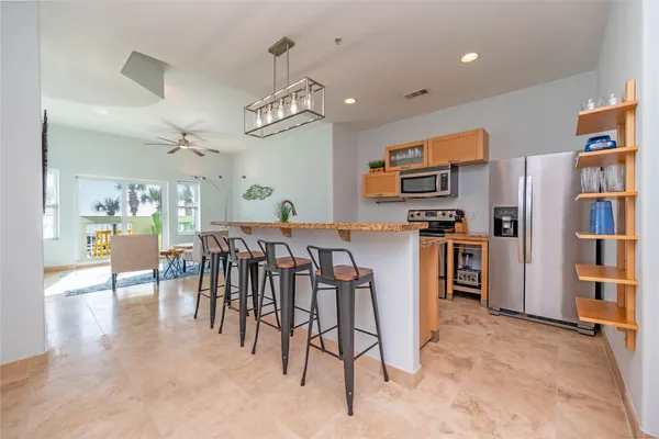 a view of a kitchen and dining room