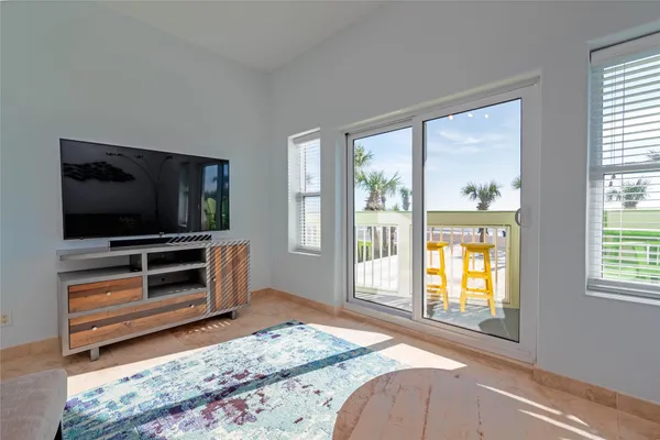 a bedroom with a bed and flat screen tv