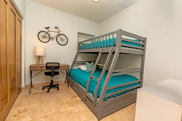 a bedroom with bunk bed