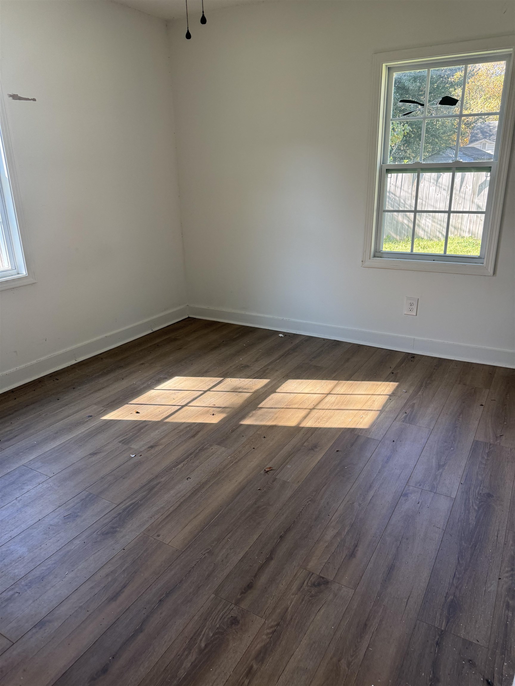 809 North Dargan Street Florence, SC 29506 - Photo 3 of 13 Empty room featuring dark wood finished floors