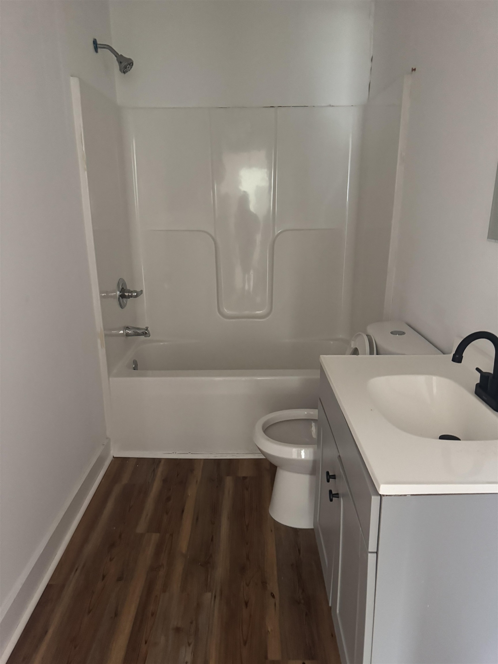 809 North Dargan Street Florence, SC 29506 - Photo 5 of 13 Full bath featuring washtub / shower combination, vanity, and dark wood-style floors