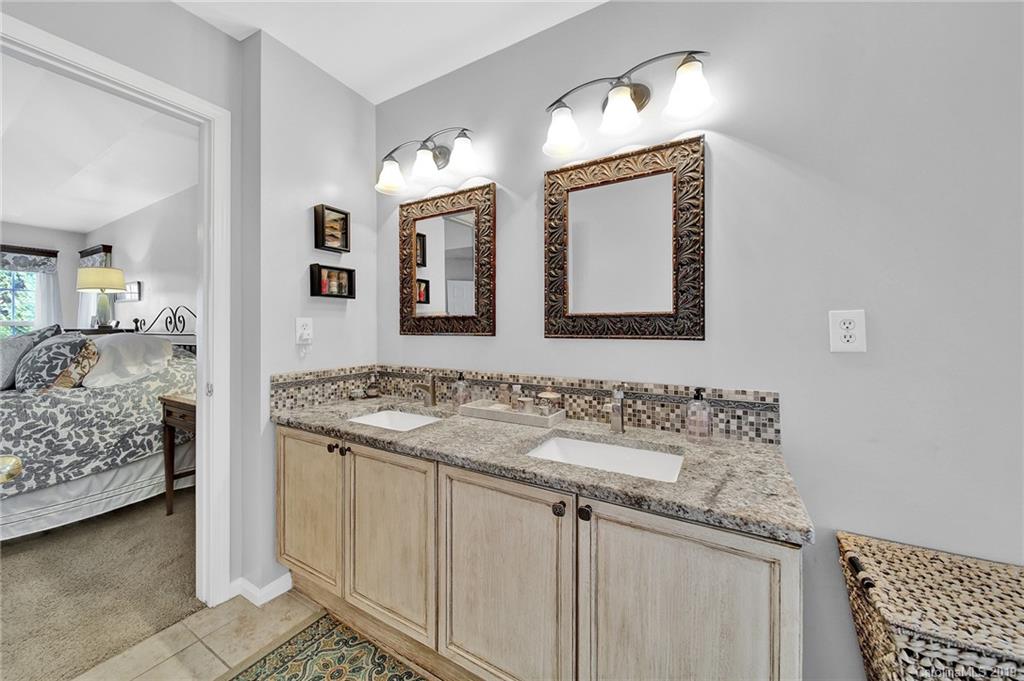 720 Warwick Way Fort Mill, SC 29708 - Photo 18 of 36 a en suite bathroom with 2 sink and a mirror