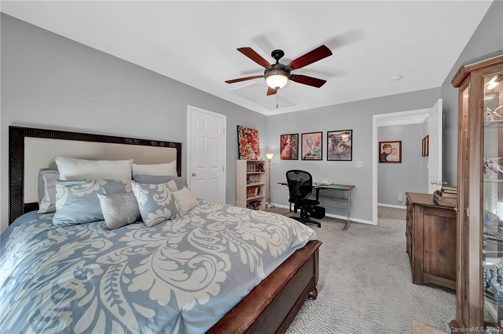 720 Warwick Way Fort Mill, SC 29708 - Photo 20 of 36 a bedroom with a large bed and furniture