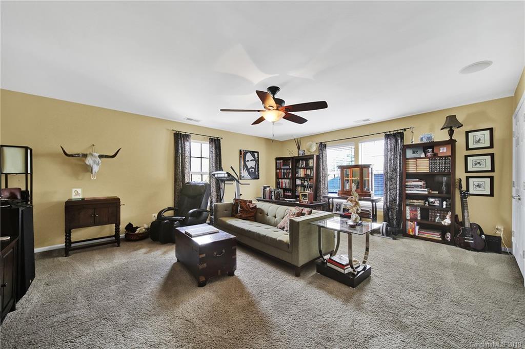 720 Warwick Way Fort Mill, SC 29708 - Photo 21 of 36 a living room with furniture gym and a window
