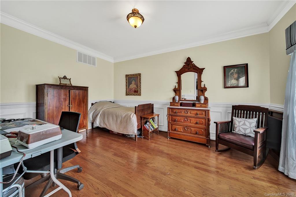 720 Warwick Way Fort Mill, SC 29708 - Photo 27 of 36 a bedroom with bed and a couch