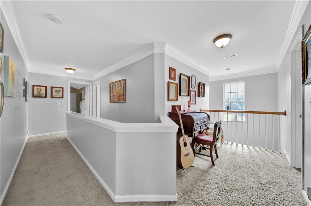 720 Warwick Way Fort Mill, SC 29708 - Photo 28 of 36 a view of a livingroom with furniture and white walls