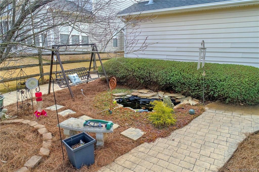 720 Warwick Way Fort Mill, SC 29708 - Photo 33 of 36 a view of a chairs and table in backyard