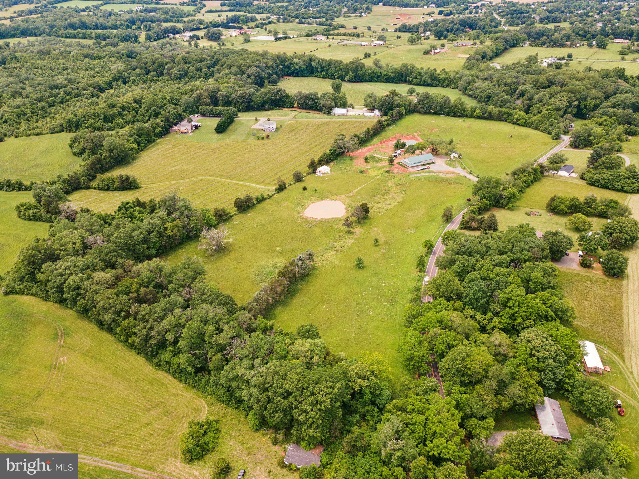 7285 Opal Road Warrenton, VA 20186 - Photo 2 of 34 a view of a lake with a mountain in the background
