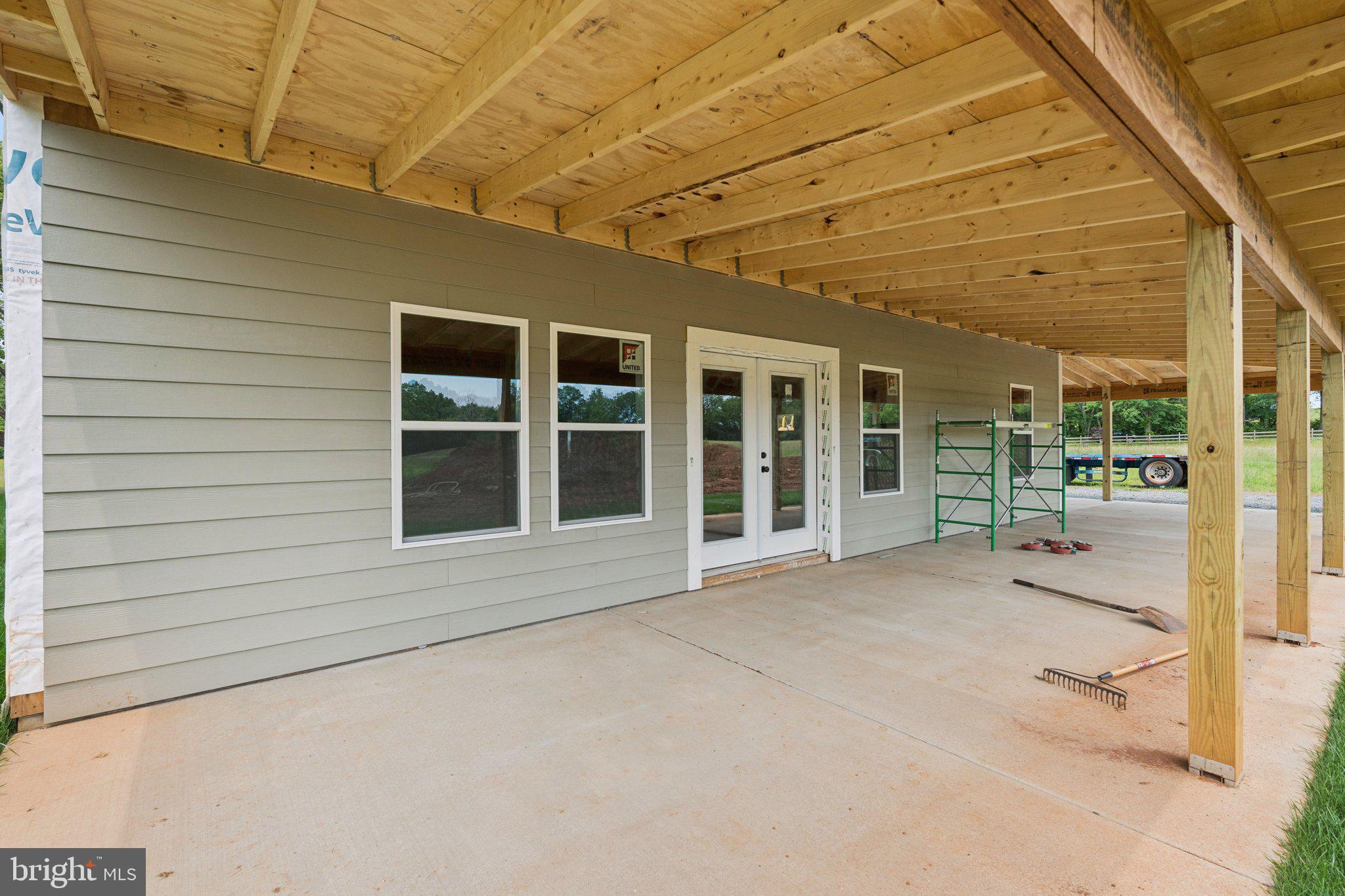 7285 Opal Road Warrenton, VA 20186 - Photo 21 of 34 a view of a brick house with a large window