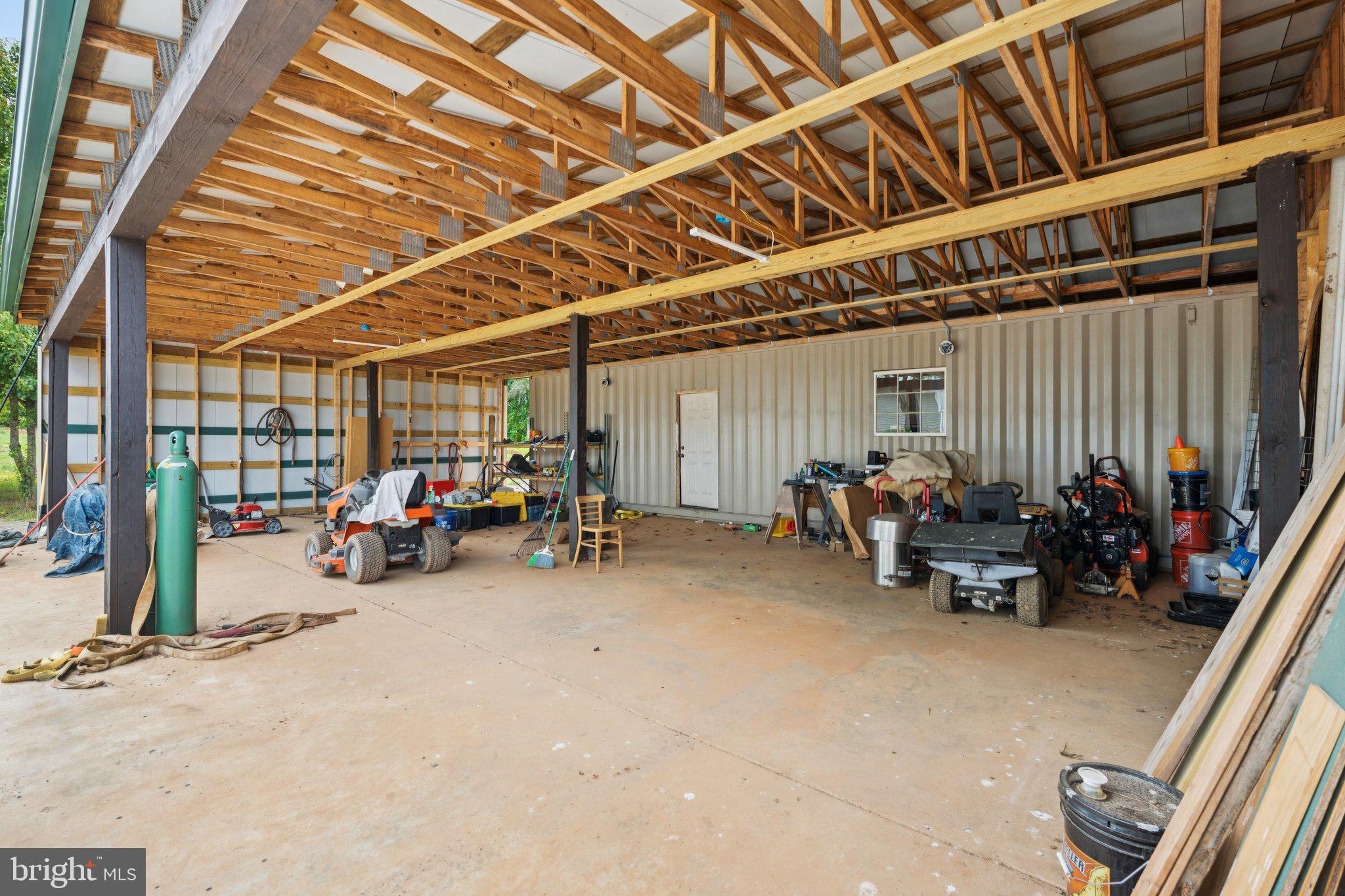 7285 Opal Road Warrenton, VA 20186 - Photo 23 of 34 a view of a garage with parked cars